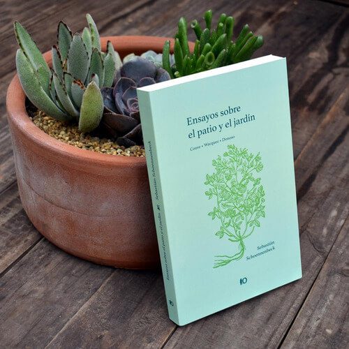 Composición del libro "Ensayos sobre el jardín: paisaje, alegoría y relato", junto a cactus